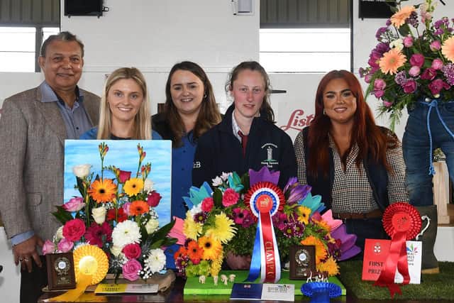 Members who won the 21-25 section in the floral art competition with judge, Gregory Baptie (left), YFCU president, Stuart Mills (centre), Kerri Ann Curran, Power NI (centre left)