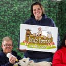 Kenny and Noelle Walsh from Kidz Farm are joined by Takara Earle–O’Callaghan as they celebrate joining the new Children’s Area at the Balmoral Show