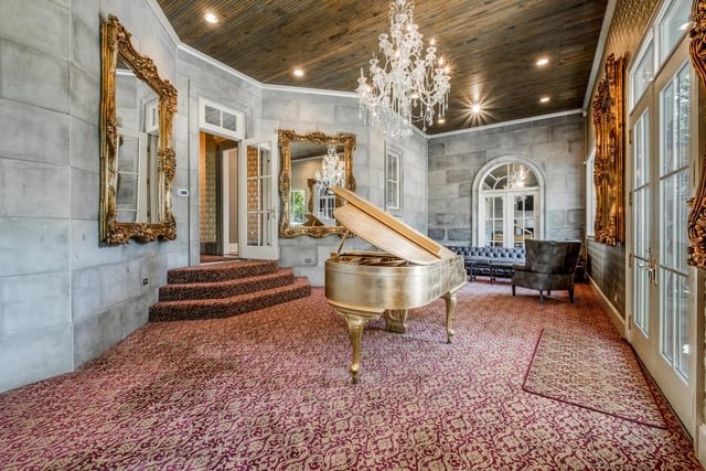 The 15,000 square foot home boasts four bedrooms, eight bathrooms, and countless exquisite details, including antique fixtures from Argentina and lead crystal chandeliers from the Czech Republic, including one autographed by Dolly Parton.