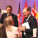 Minister Gordon Lyons speaking to delegates at the inscription ceremony in the United States.