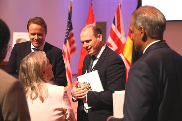 Minister Gordon Lyons speaking to delegates at the inscription ceremony in the United States.