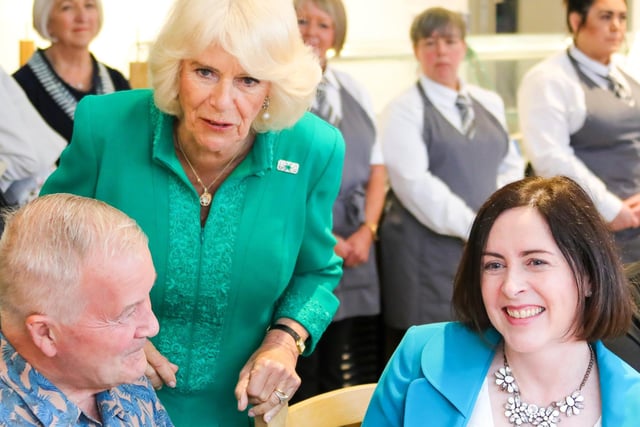 The Queen is pictured with Billy Cathcart and Caroline Doherty of TACA in Templepatrick at a very special celebration at Enniskillen Castle in Fermanagh.