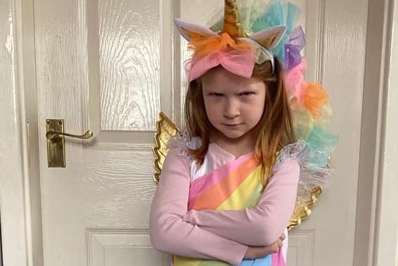 Six year old Lily has dressed up as the wonderful Grumpycorn, a character created by author Sarah McIntyre.