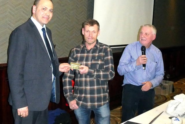 Kemal, duty manager of the Dunsilly Hotel, presented with a plaque by Alan McAteer. Picture: Alan Hall
