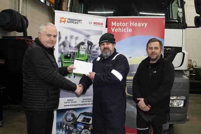 Mark Bowring, from Magheralin, a Level 3 Vehicle Maintenance & Repair (Heavy Vehicle) apprentice, employed by the Education Authority who took first place in SERC’s Heavy Vehicle College Competition.  Left to right, David Monroe, Director, Transport Supplies (NI) Limited, Mark Bowring, and Michael Hutchinson, Lecturer in Motor Vehicle. Picture: SERC