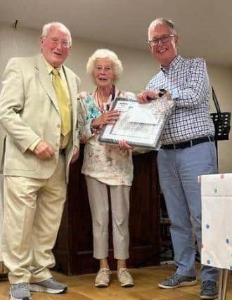 Tom & Iona Glenny being presented with a gift to mark a combined 40 years service by Show Chairperson Winstom Humphries