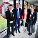 Education Minister Paul Givan joins Principal Dr Michelle Rainey, Head Girl Maisie and Head Boy Adam at Ballyclare High School to announce that three post-primary school projects are moving forward to the design and planning stage.