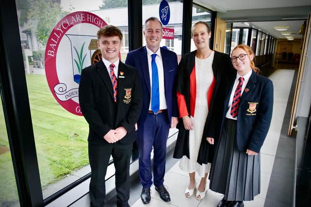 Education Minister Paul Givan joins Principal Dr Michelle Rainey, Head Girl Maisie and Head Boy Adam at Ballyclare High School to announce that three post-primary school projects are moving forward to the design and planning stage.