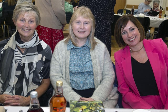 ALL SMILES. Irene Nevin and fellow WI members at the Anniversary dinner.