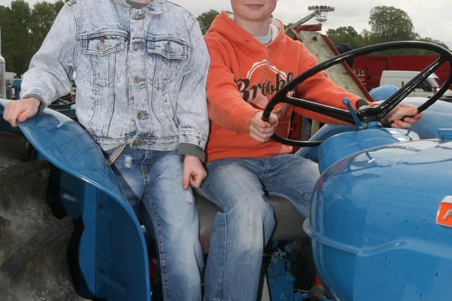 Scott and Jack Stevenson on one of the vintage tractors during the Shane's Castle Steam Rally