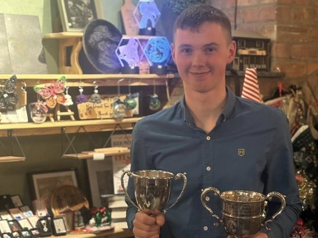 John Hamilton with his award at Donaghadee YFC's recent annual Christmas awards dinner at Saints N’ Sinners in the seaside town.