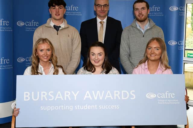 Foundation Degree Agriculture and Technology Bursary recipients. Back row (L-R) Ben Lindsay, Mr Martin McKendry, CAFRE Director, and Reuben Sweeney. Front row (L-R) Emma Campbell, Molly-Jayne Kelly, and Ellie Stinson.