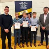 Pictured is the winning 12-14 group debating team from Donaghadee YFC receiving their certificates from guest speaker David Duly (Left) and YFCU deputy president Richard Beattie (right). Picture: Submitted