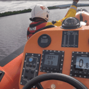 Carrybridge RNLI tasked to assist 2 people and 2 dogs on a barge that had run aground