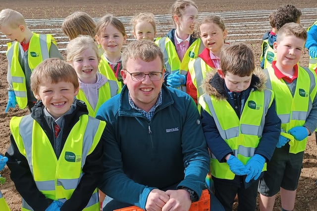 Pupils from Hardy Memorial Primary School pictured with Head of Farm Operations at Gilfresh Produce, Richard Gilpin during their recent visit to the company. The pupils planted some pumpkins and got a tour of the facilities at Gilfresh.
