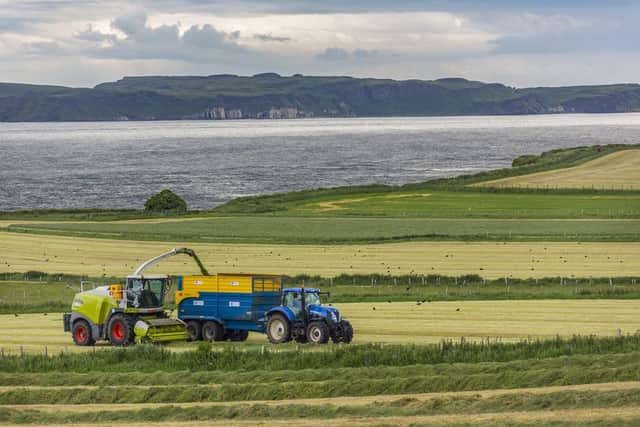 Collecting silage in the fields near Ballycastle in County Antrim, Northern Ireland. (Pic: Steve Allen Photo)