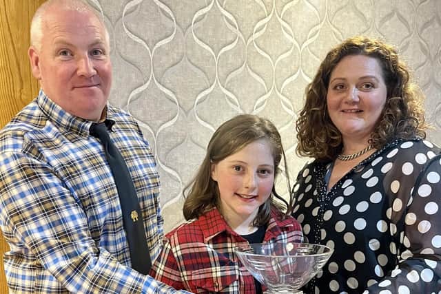 Chairman Eddie O’Neill presenting Elizabeth McAllister and daughter Sarah Wilson with a cup for winning Champion Show Flock.
