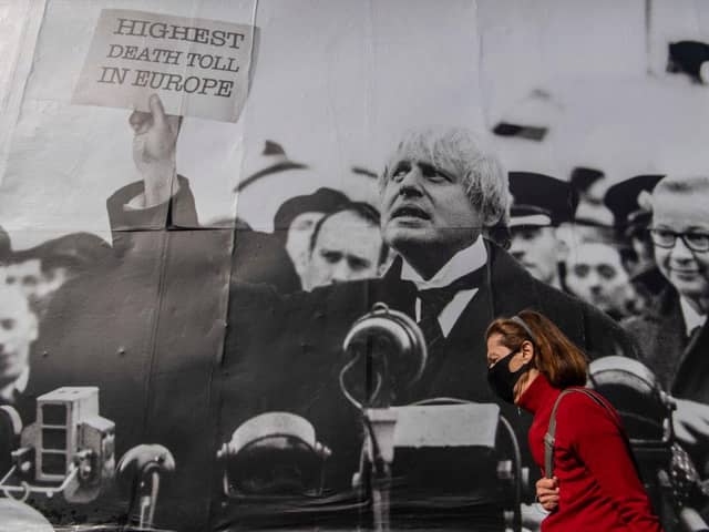 A satirical poster from the group Led By Donkeys depicting Boris Johnson as former British prime minister Neville Chamberlain delivering his “Peace for Our Time” speech in Kentish Town, London (Photo: Justin Setterfield/Getty Images)