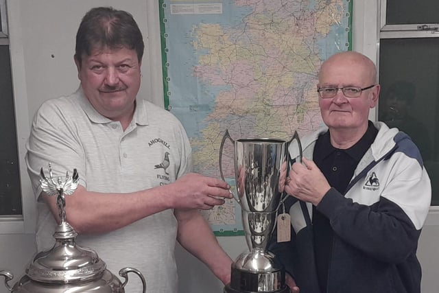 Chairman James O’Neill presents the top prize=winning cups to Paddy McManus. Pic: Willy Reynolds