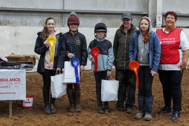Margretta Chambers from Air Ambulance NI presenting the prizes to the winners in the 60cms class.  Also in the photo is Ruth Baird from the Gamekeepers Lodge.