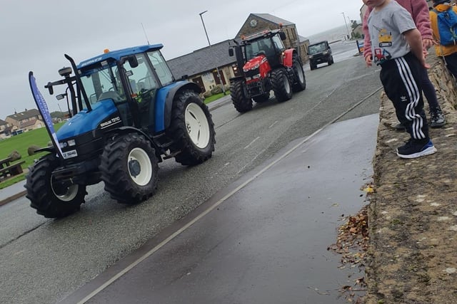 Laura Bartley in her Newholland followed by Joshua Minis in his Massey and John Fisher in his Gator.