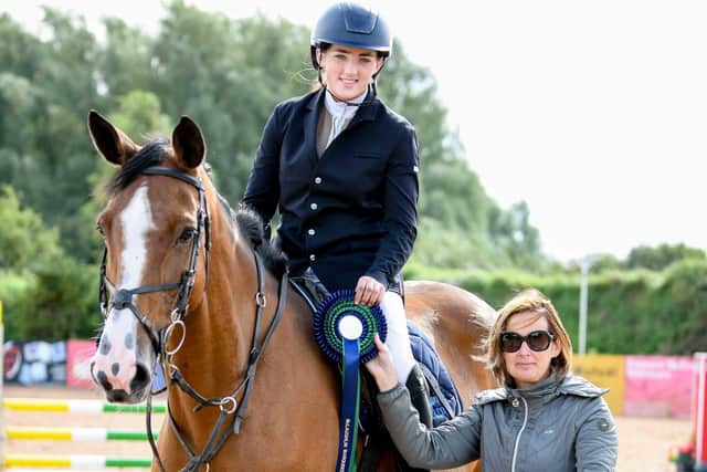 Lucy Morton riding Drumiller Balto, winners of the 2* and 3* Classes (presented by sponsor Paula McLaughlin from McLaughlin Marquees.