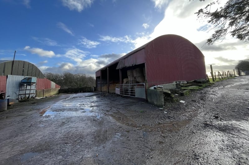The dairy yard is accessed from the Drum Road and comprises of two large arched barns in poor conditions, a dairy, a small piggery, and other lying-in sheds