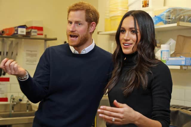 Prince Harry and Meghan Markle pictured during a visit to charitable food shop Social Bite in Edinburgh (Picture: Owen Humphreys/WPA pool/Getty Images)