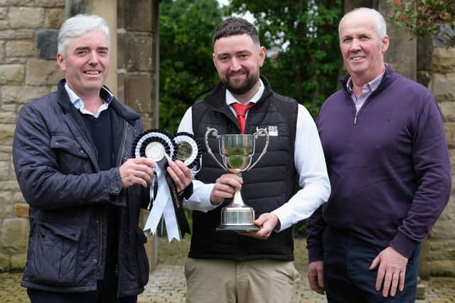 Discussing plans for the Kilrea bull sale are Holstein NI committee members Stuart Smith and Wallace Patton, with Conal Daly, Genus ABS, sponsor. Photograph: Columba O'Hare/ Newry.ie