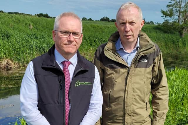 IFI CEO Dr Eamonn Kelly and Minister Timmy Dooley TD at the River Glyde.