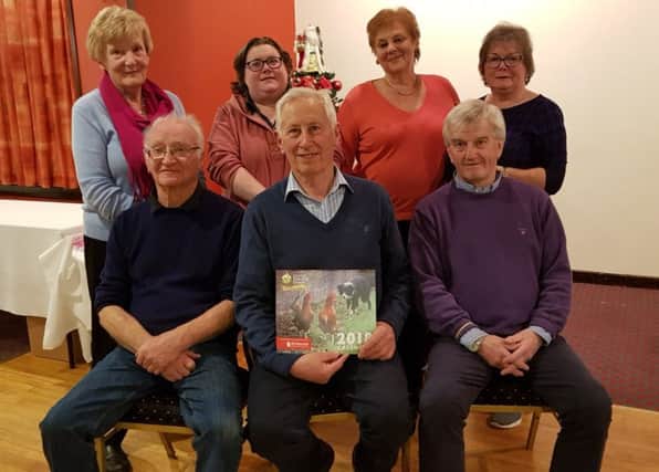 The winning team at East Tyrone Table Quiz, including, front from left, Maurice Clements, winning team leader, Billy Armstrong, Group Chairman, and Wesley Hutton, quiz master