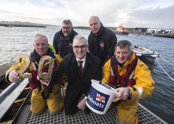 Northern Ireland wind energy company, Simple Power, has announced its long-term support for the RNLI (l-r) Coxswain Des Austin, Kerry Gregg, Deputy Launching Authority, Simple Power Chief Executive Philip Rainey, Life Boat operations manager Keith Gilmore and crew member Tim Nelson.