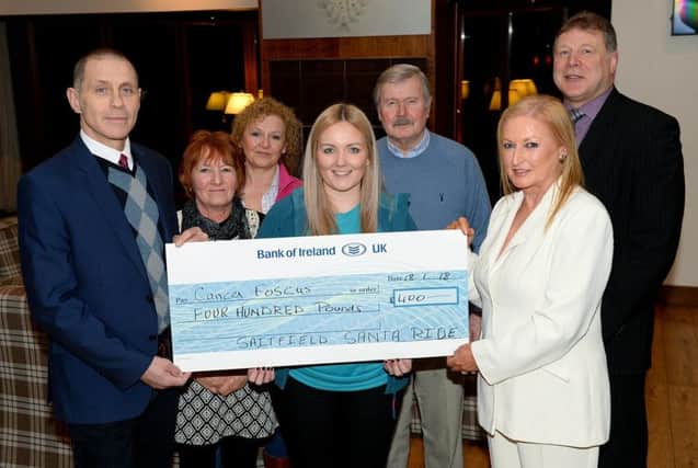 Joan Cunningham, organiser of Saintfield Christmas Charity Ride, and Alastair McIlveen, North Down Marquees, present a cheque to Joanne Ogle, Community Fundraiser for Cancer Focus. Included are Vi Patterson, Lorraine Johnston, Michael Andrews and John Barclay (Manager of the Bank of Ireland, Downpatrick) at a Reception in The Temple Golf Club last Thursday evening. Pictures: Sporting Images

Caption for pic 3
Joan Cunningham Organiser of The Saintfield Christmas Charity Ride and Vi Patterson present a cheque to Phyllis Hasson Rock Ministries N.I.
Trust. from left Alastair McIlveen North Down Marquees major sponsor of the Event, Ian Hasson Rock Ministries, Maurice Hanna, Michael Andrews and John Barclay(Manager of the Bank of Ireland Downpatrick) at a Reception at the Temple Golf Club last Thursday evening.