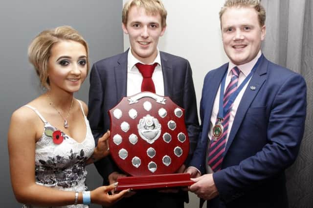Members' member 2017, Andrew Servis, Cookstown YFC receiving his award from guest speaker Mr James Speers and county PRO Natalie Burrows
