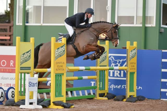 Johnny Mulligan riding Mando, clear in the 1.10m