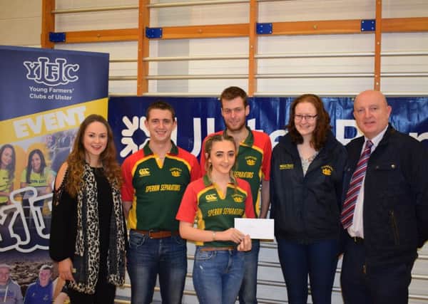 The Cappagh YFC team who were awarded first place in the NI Quiz, Craig Burrows, Natalie Burrows, James McKay and Katie McKay receiving their prize of Ã‚Â£300 from Martin Convery, business development manager, Ulster Bank and Zita Blair, YFCU deputy president and quiz master for the evening