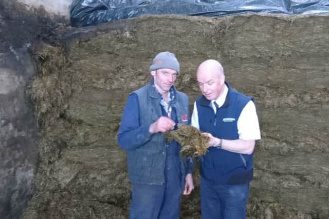 Barry Meeke, newcomer winner in group silage competition, with judge Raymond Bready.