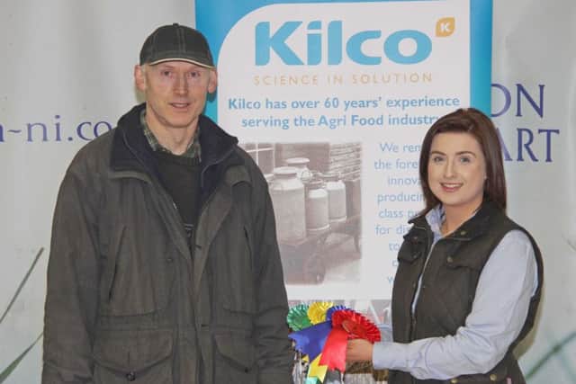 Stephen Greenaway, Annaghmore, won first, second, third and fourth in the class for non registered in-millk heifers at the Dungannon Dairy Sale. He was congraulated by sponsor Emma Hughes, Kilco.