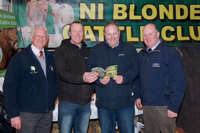 Lexie Johnston and Brian McGartland, both of the Blonde Club, with Steven Redmond, Dungannon mart, and Alan Carson, sponsor, discussing entries for the upcoming sale.