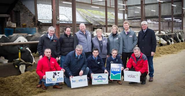Unveiling plans for Holstein NI's 3rd annual open day on Saturday 21st April are, back row from left: Victor Chestnutt, deputy president, UFU; Holstein NI vice chairman Jason Booth; host farmers Alan, Sylvia, Heidi and David Irwin, Redhouse Herd, Benburb; and David Perry, president, Holstein UK. Front row, from left: Tommy Henry, chairman, Holstein NI; John Martin, Holstein UK; and principal sponsors Wayne Cunningham, Fane Valley Feeds; Gary Watson, Dale Farm; and Alistair Sampson Volac. Picture: Devennie Photography