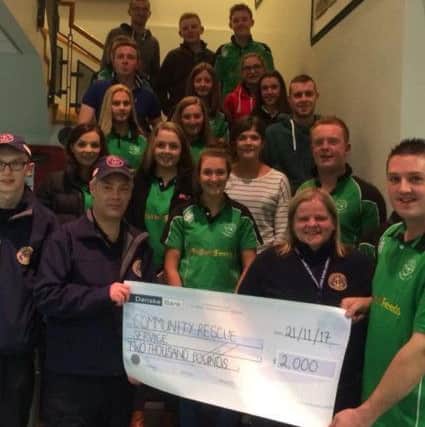 Members presenting a cheque of Â£2000 to the Community Rescue Service Portglenone.