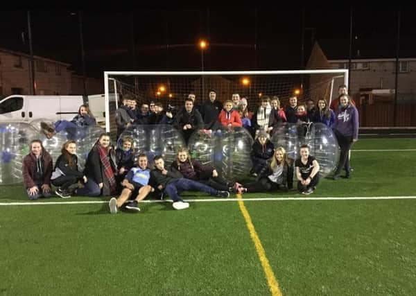 Holestone YFC members giving bubble football a try at a recent club meeting