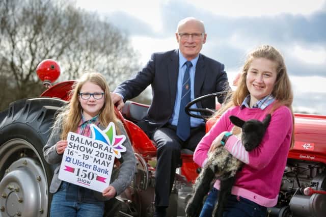 RUAS President Cyril Millar is pictured with Lauren and Lucy Cheatley at the 2018 Balmoral Show Launch.