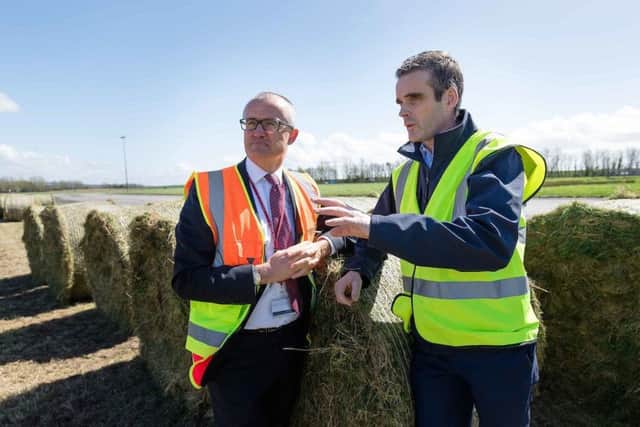 Niall Maloney, Director of Operations Shannon Airport and Joe Healey, National President IFA at Shannon Airport as Local farmers cut sileage at the Airport's 400 acres today to alleviate the fodder crisis. Photograph by Eamon Ward (Further information available from Eugene Hogan Email: eugene.hogan@bridgepr.ie
Tel: Mob +353 (0) 87 2497290 )