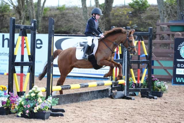 Edward Walsh riding Sparkling Little Princess, clear in the 128 50cm
