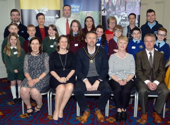 Pictured at the Moypark Healthy Eating Challenge for primary schools at the Seagoe Hotel are Moypark and Young Enterprise staff and pupils from Moyallon, Ballyoran and St Anthony's primary schools and front row from left, Una Barker, Moypark, Carol Fitzsimmons, CEO, Young Enterprise, Councillor Sam Nicholson, deputy mayor of ABC Council, Mary Daly and Brian Moreland, Moypark. INPT16-204.