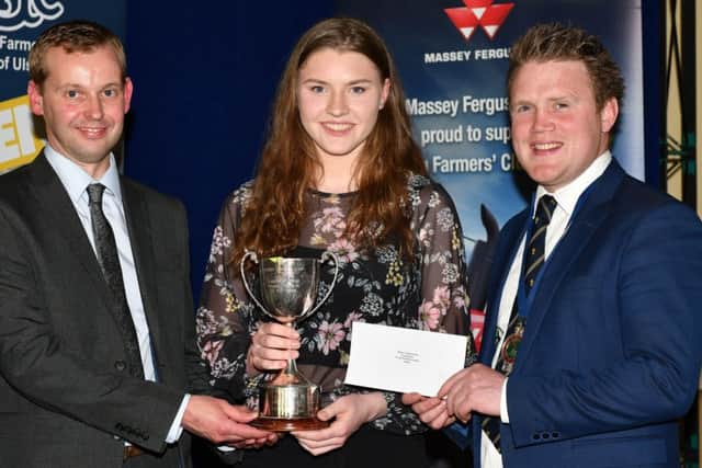 Winner of the Junior Ulster Young Farmer of the Year, sponsored by Danske Bank, is Anna Boyd, Straid YFC. Anna is pictured receiving the Robin Swann Trophy from Ian Dunlop, Danske Bank and YFCU president James Speers