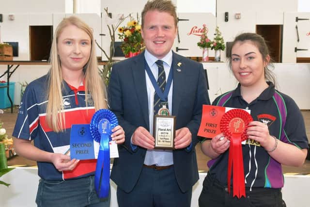 16-18 age category: Pictured are the 16-18 age category winners in the YFCU Floral Art Competition. From left-right: 2nd place winner, Lauren Millar, Moneymore YFC; YFCU President James Speers; 1st place winner, Dione Stewart, Kilrea YFC. Absent from photo: 3rd place winner, Connor Woods, Annaclone and Magherally YFC.