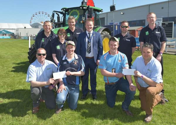 Pictured receiving their first place prize in the YFCU machinery handling competition, from Johnson Gilpin representatives are Co Londonderry members Geoff McNeill, Garvagh YFC (front row, left) and James Purcell, Dungiven YFC (front row, right). YFCU president James Speers is pictured (back row centre) alongside members of HSENI who helped design the course and oversee the safety element of the competition on the day
