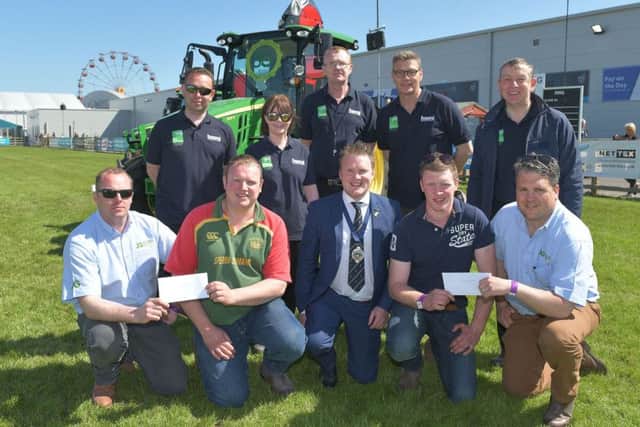 Pictured receiving their second place prize in the YFCU machinery handling competition from Johnson Gilpin representatives, are Co Tyrone members, Adam Wilson, Cappagh YFC (front row left) and Henry Giles, Seskinore YFC (front row right). Also pictured is YFCU president, James Speers (front row centre) and members of HSENI who helped design the course and oversee the safety element of the competition on the day